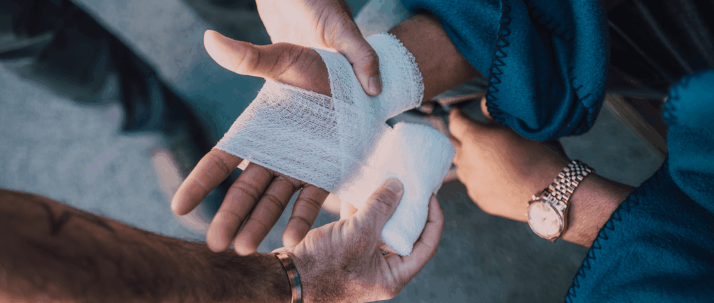 Bandage wrap being applied to an injured hand
